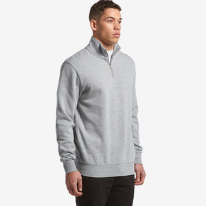 Man wearing AS Colour Men’s Stencil Half Zip Fleece Pullover in Grey Marle Front Side Angle - 5125