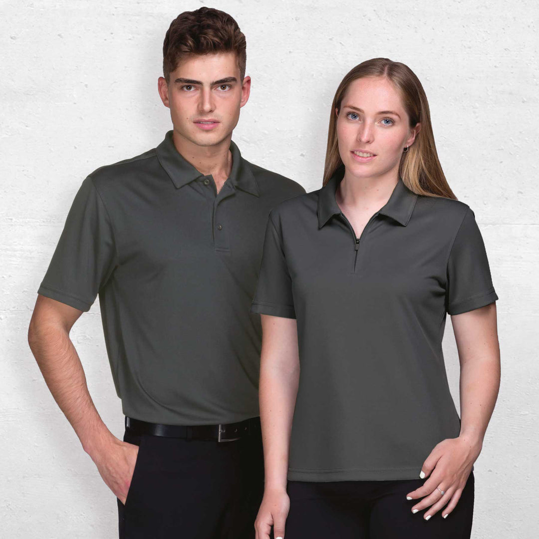 Man and woman wearing Gear for Life Women's Axis Dri Gear Polo - WDGAXP